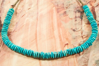 Genuine Sleeping Beauty Turquoise Necklace with Pen Shell Heishi. Sterling Silver Clasp. Created by Navajo Artist Petra Vandever.